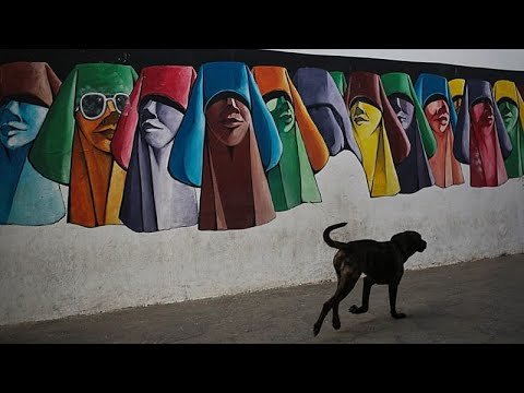 Moroccan artists Mohamed Roshdi and Mizmiz at work during JIDAR 2026