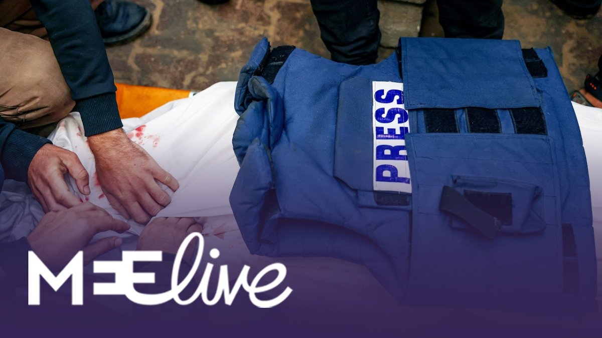 Press credentials and notebooks belonging to Palestinian journalists