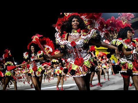 Ifá divination symbols and Yoruba heritage celebrated in the blue and yellow costumes of Paraíso do Tuiuti, Rio Carnival 2026