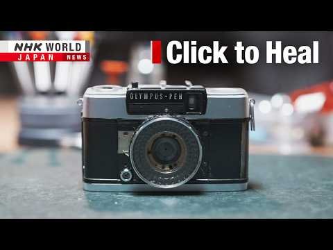 Young photographer using a vintage film camera in Tokyo