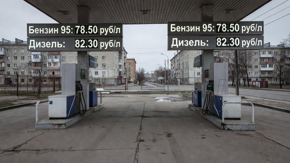 Empty gas station forecourt in Russia with high fuel prices displayed