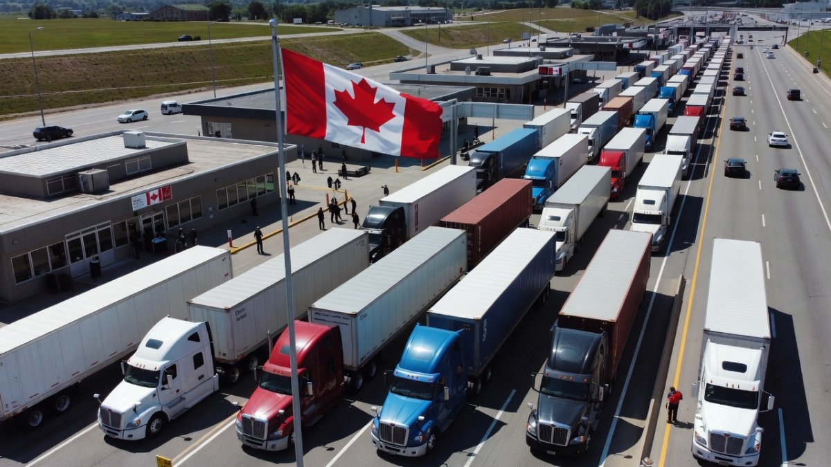 Canada-US border crossing with commercial trucks, trade impacted by Trump 50 per cent tariffs
