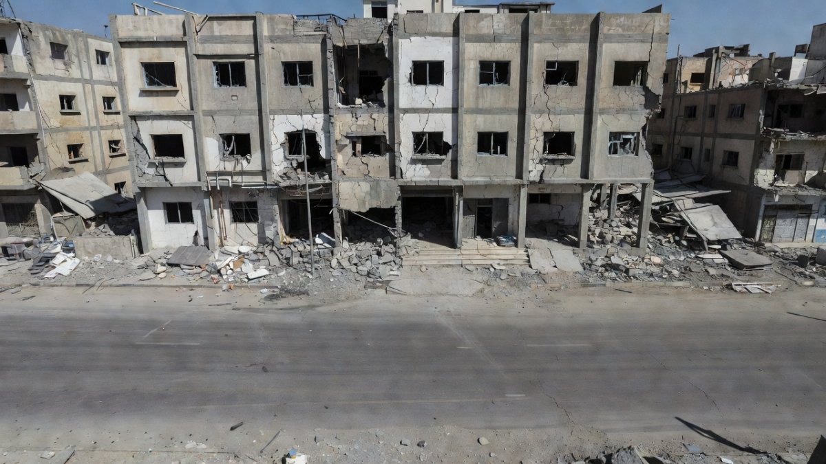 Partially damaged hospital exterior in Gaza City reflecting collapse of healthcare infrastructure under prolonged conflict