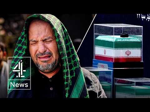 Flag-draped coffins of Khamenei and family members displayed in glass cases at the Grand Mosalla