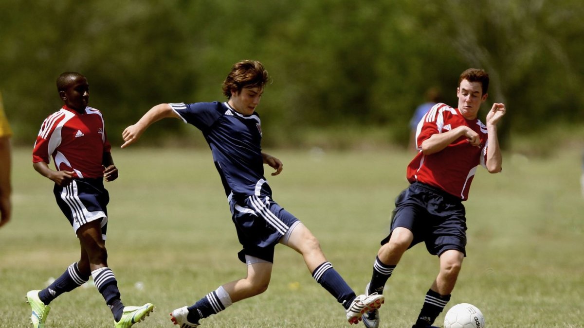 Footballers on a pitch, the game fans say belongs to the people