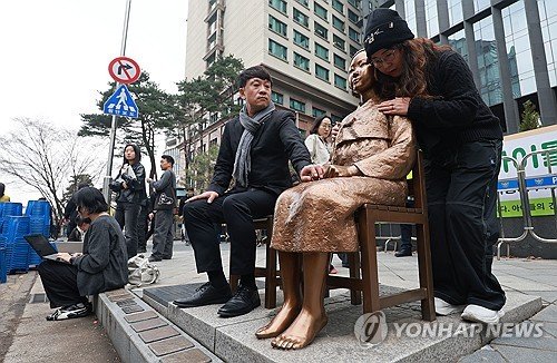 Statue of Peace in Seoul with barricade being removed on 1 April 2026