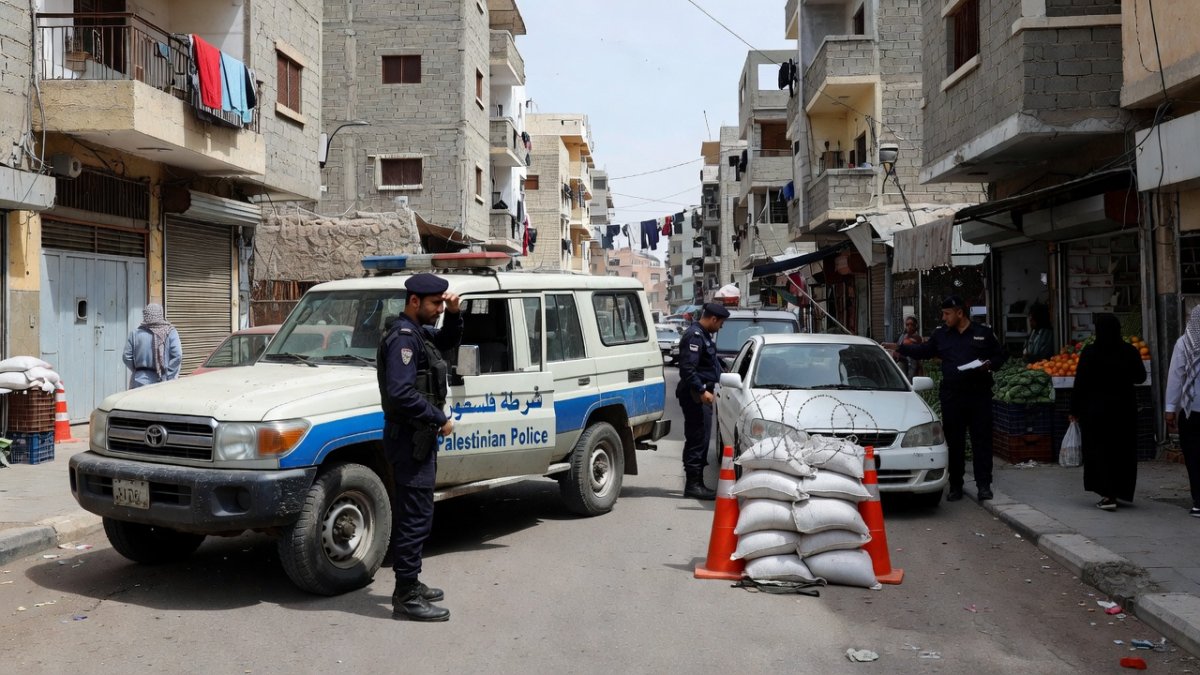 Palestinian Authority security forces at a checkpoint in the occupied West Bank, illustrating the security coordination mechanism established under the Oslo Accords
