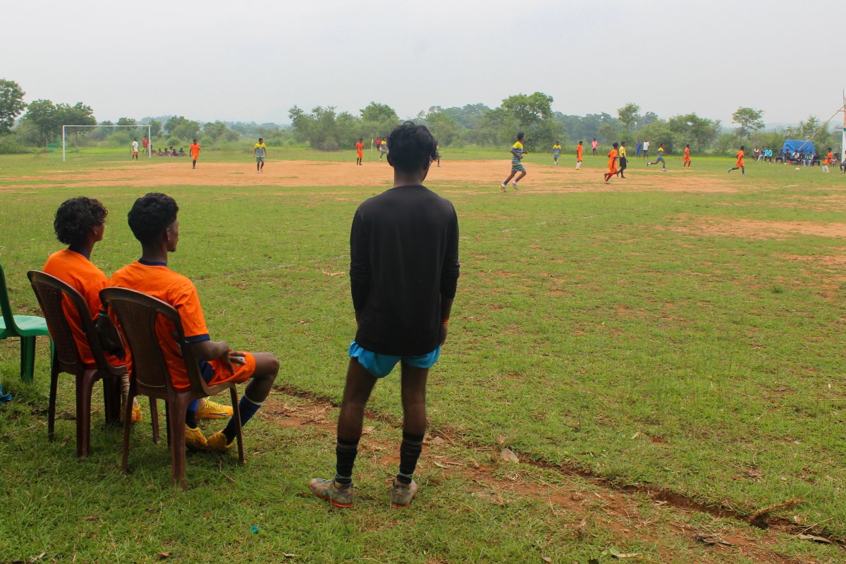 Football match in progress at the Rangila Star Tirilbasa tournament in Chaibasa, India