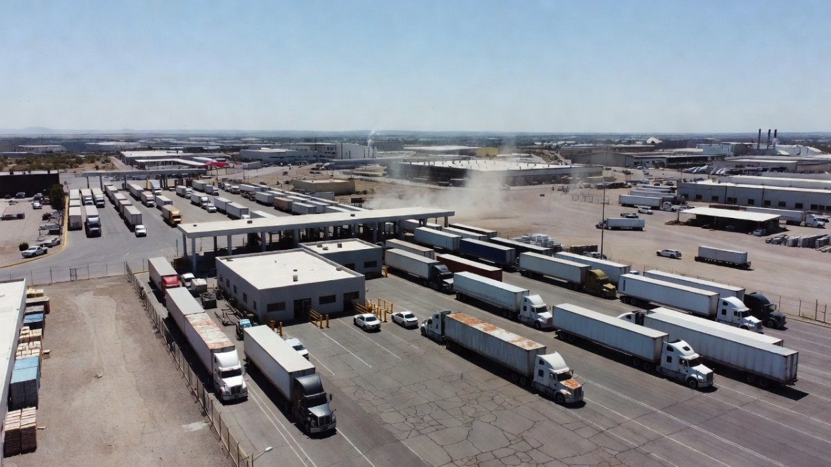 Mexican border checkpoint with cargo vehicles