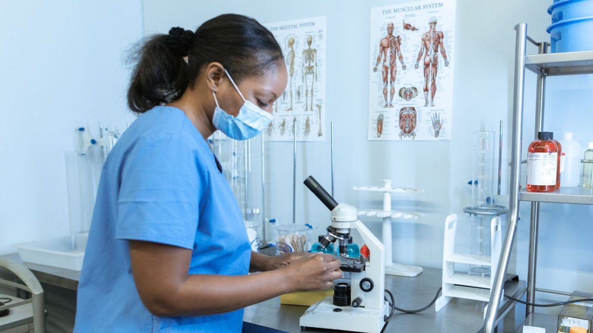 Scientist using a microscope in a modern laboratory, reflecting China's biotech innovation drive
