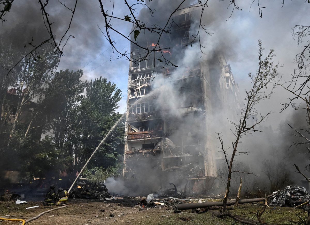 Rescue workers at the site of a Russian guided bomb attack on Zaporizhzhia