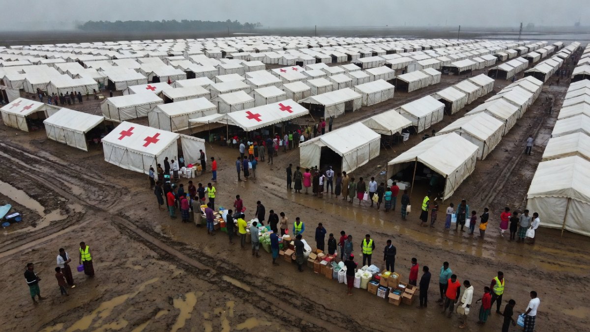 Flood relief camp with temporary shelters and medical facilities in Assam