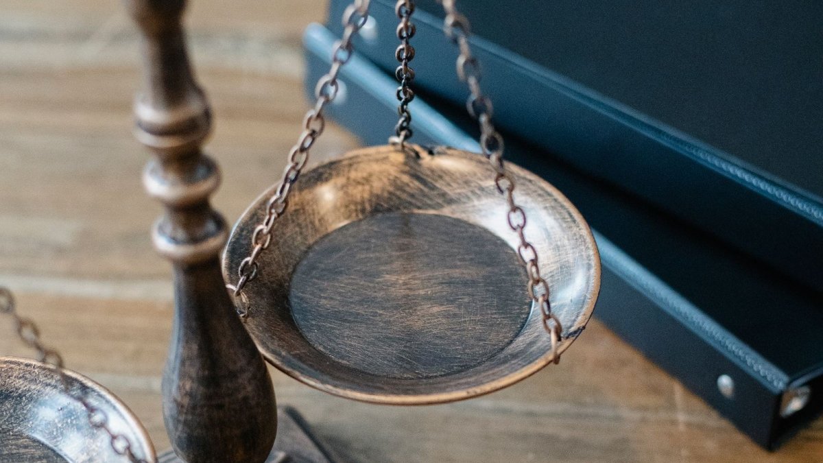 Gavel and scales of justice on a wooden desk
