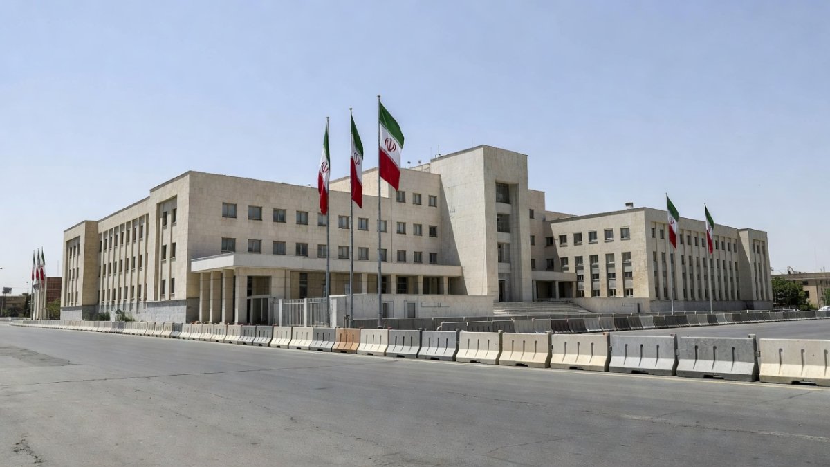 Exterior view of Iranian government building with flags in Tehran