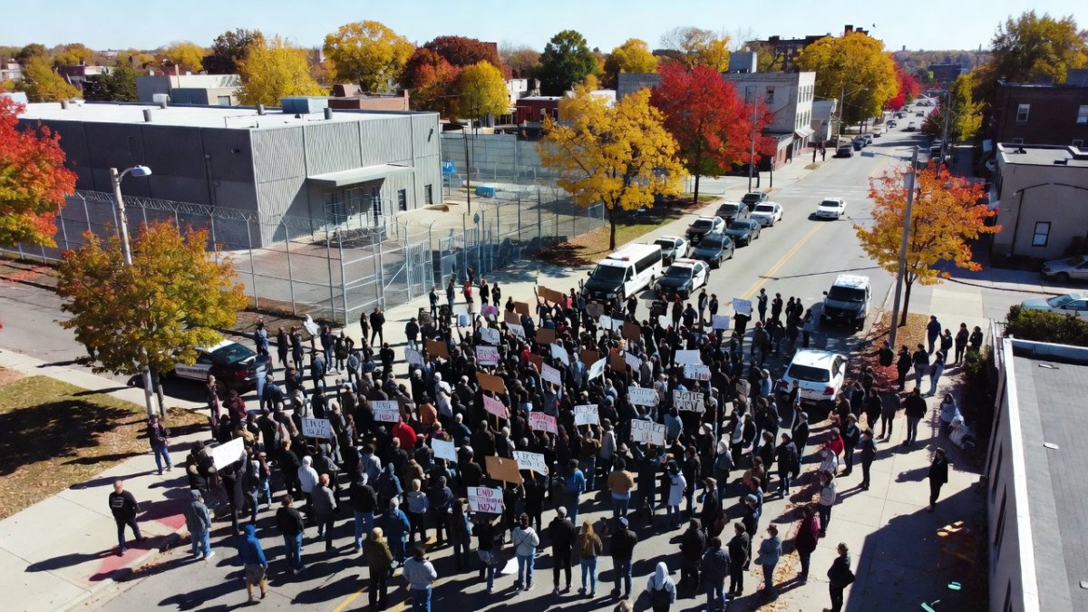 Protesters gather outside ICE detention facility in Scarborough Maine demanding justice after fatal shooting