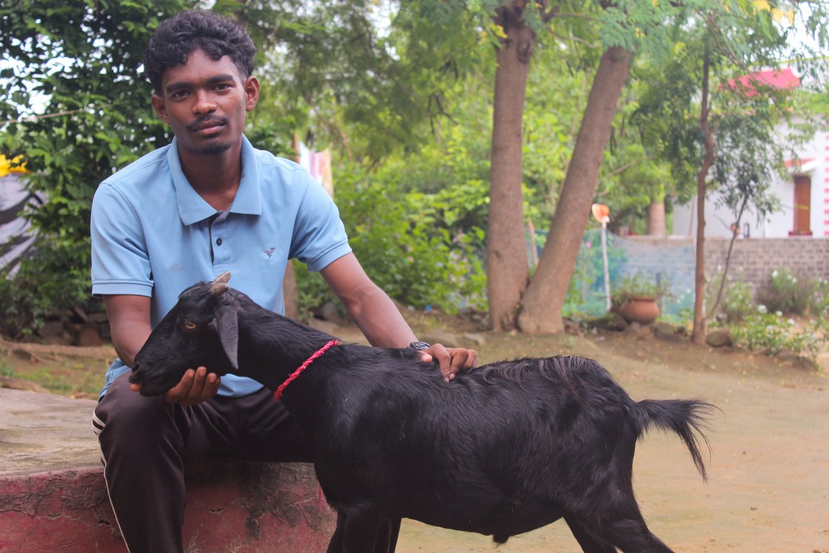 Manish Kudada with his prized khassi goat at his home in Tirilbasa, Jharkhand