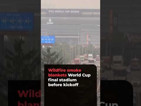 Al Jazeera English video thumbnail showing wildfire smoke at the World Cup final stadium