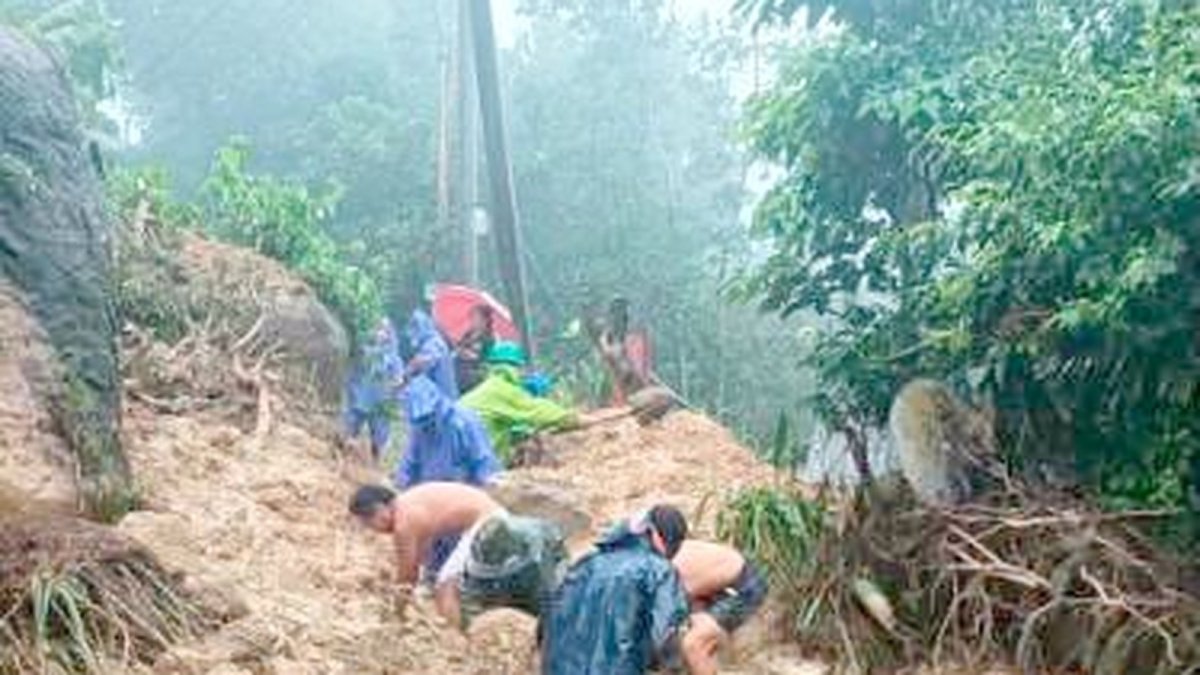 Rescuers and community members respond to a landslide in Benguet
