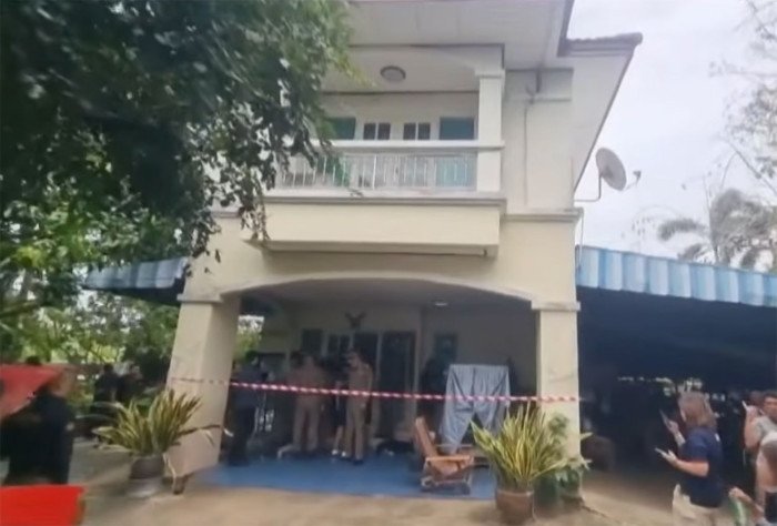 Police and forensic officers search the Nonthaburi home of the 14-year-old gunman