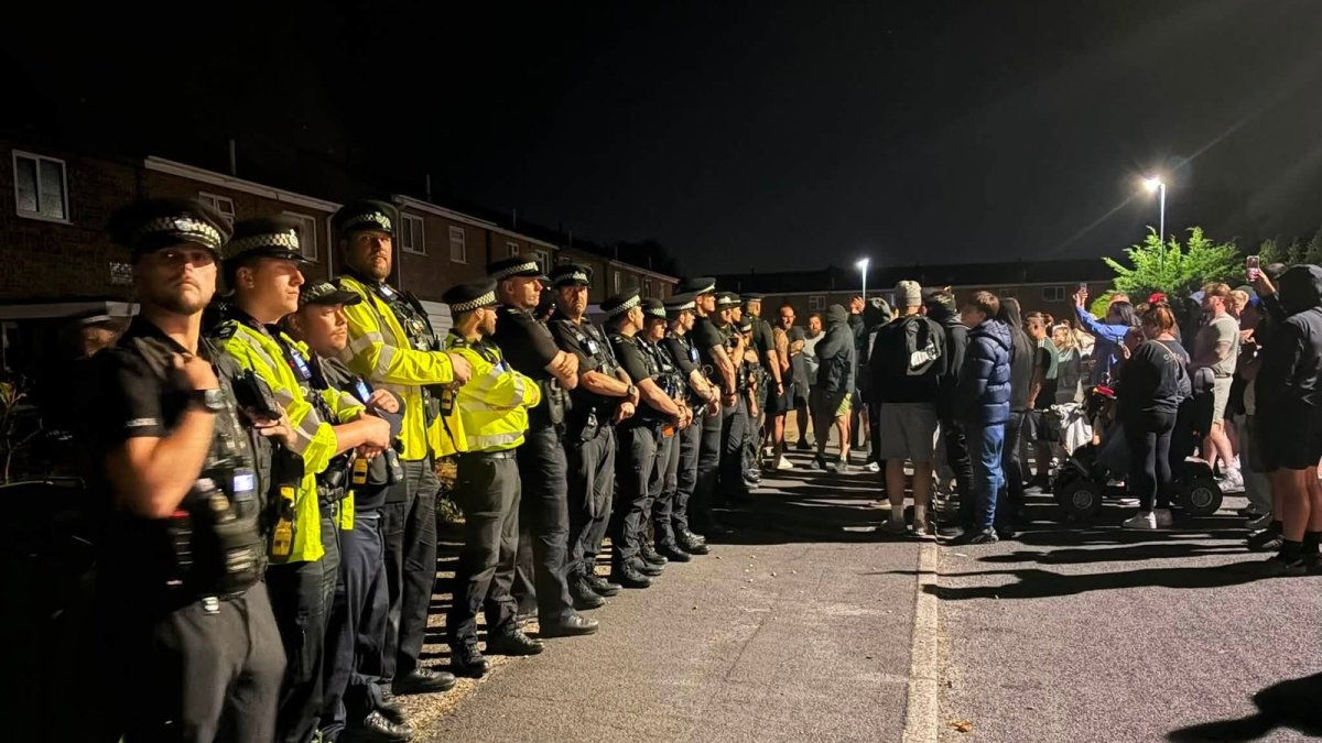 Anti-immigration protesters outside suspected asylum seeker housing in Thetford, Norfolk