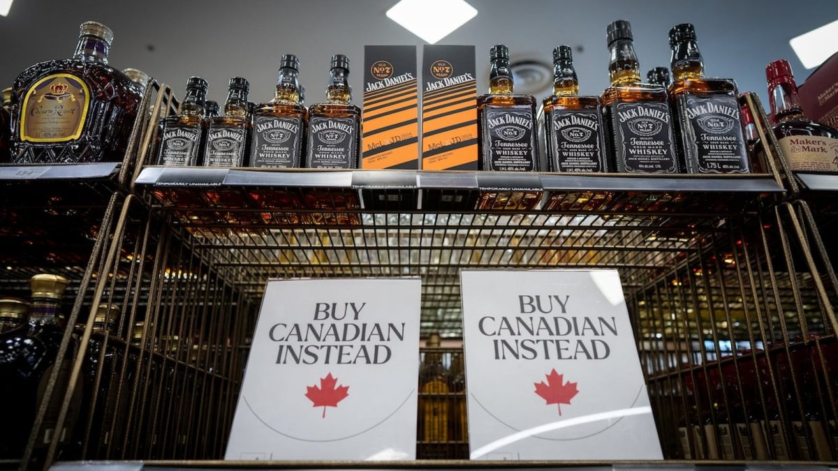 Customers browse alcohol at a Canadian liquor store amid the ongoing trade dispute with the United States