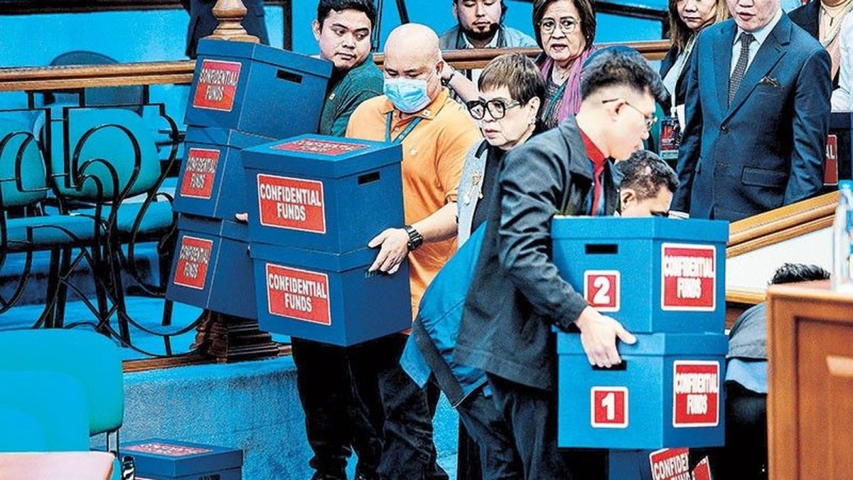 House prosecution team members with boxes of documentary exhibits at the Senate impeachment court