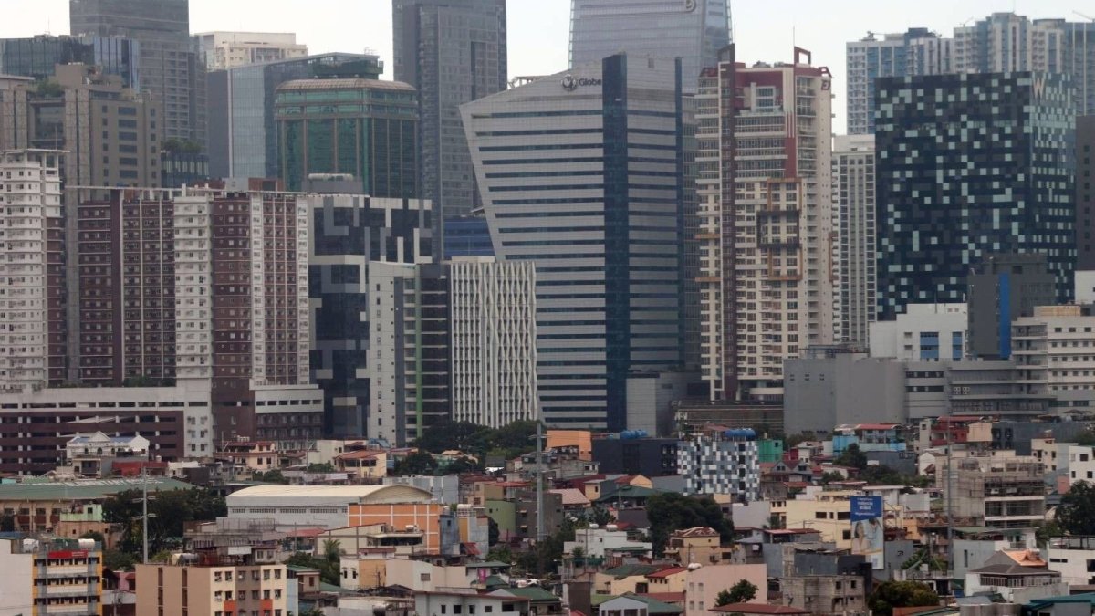 High-rise buildings in Makati City, the Philippines financial district, against the backdrop of slower economic growth