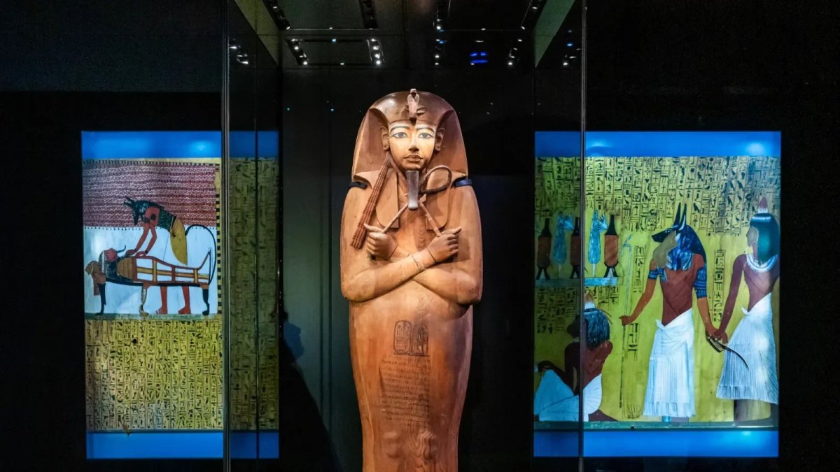 An ancient Egyptian anthropoid coffin with hieroglyphic inscriptions on display at the Ramses and the Pharaohs Gold exhibition in London