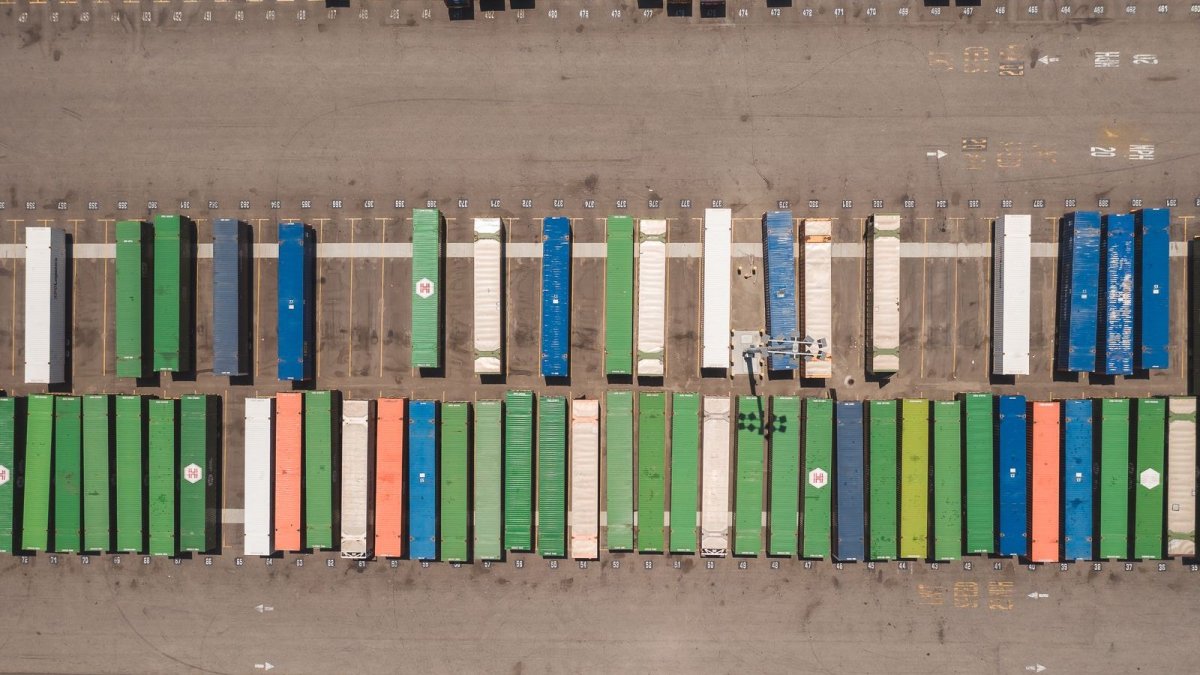 Shipping containers stacked at a port — the Canada-U.S. border moves nearly $2 billion in goods daily