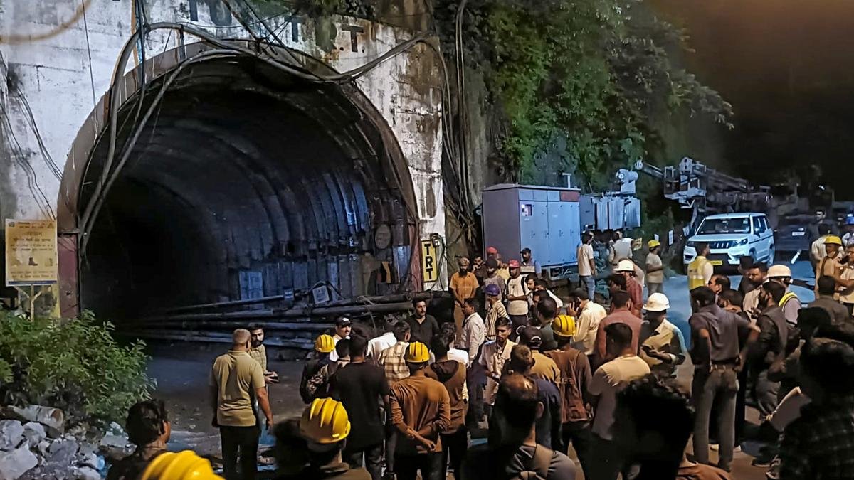 People gather near the under-construction tunnel of the Vishnugad-Pipalkoti Hydroelectric Project in Chamoli district, Uttarakhand (PTI)