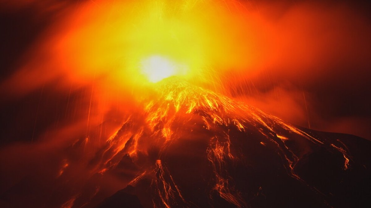 Lava flows from the crater of the Fuego Volcano as seen from San Juan Alotenango, Guatemala, on Tuesday