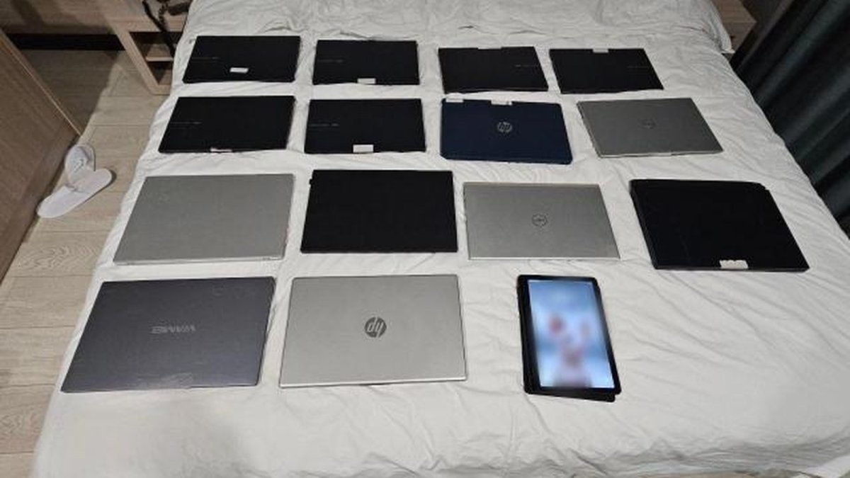 Laptops and a tablet seized by police from the scam ring's Almaty hideout
