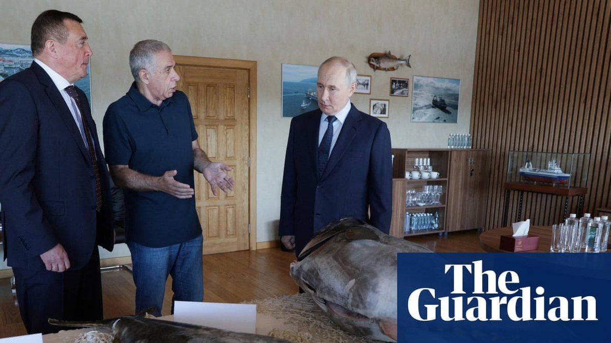 Vladimir Putin visits a fish processing plant on Iturup island, one of the disputed Kuril Islands claimed by Japan