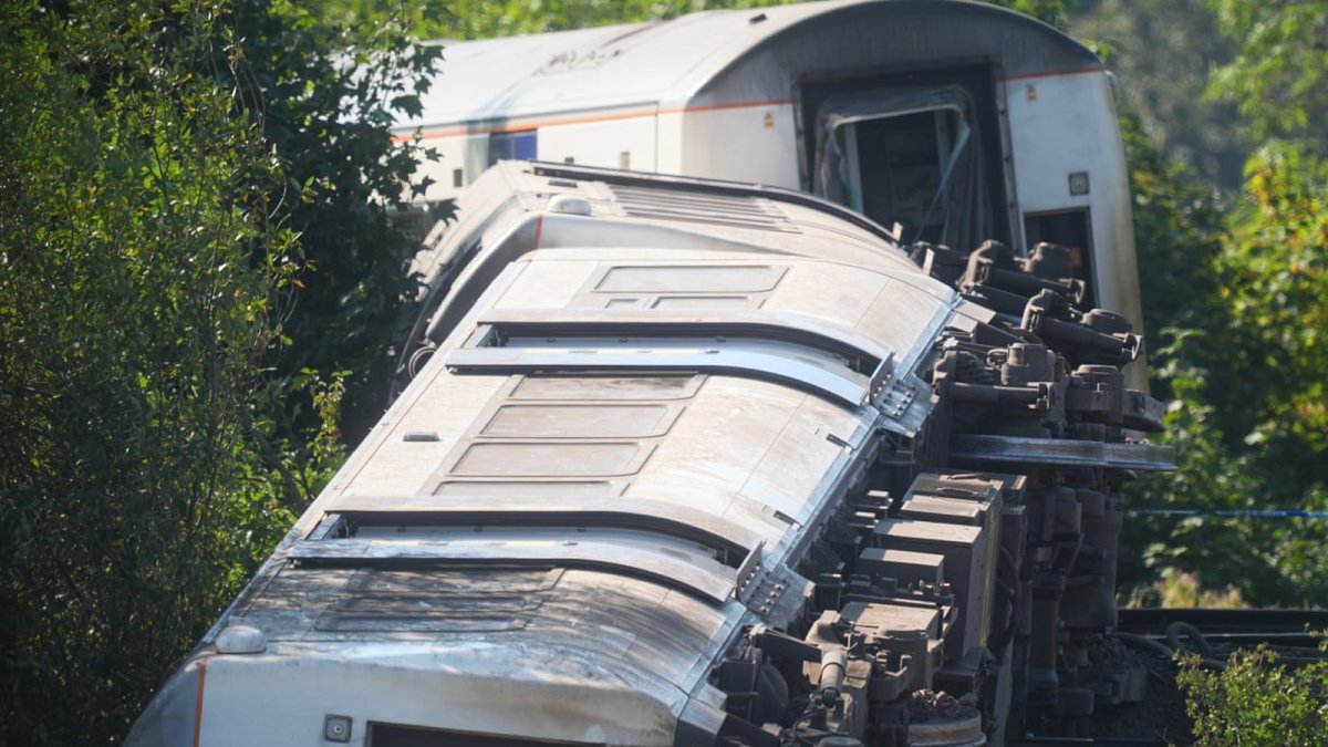 Emergency services and recovery teams at the site of the Southern Rail derailment near Lewes, East Sussex, with carriages on their sides