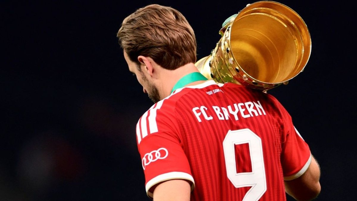 Harry Kane celebrates with the DFB-Pokal trophy after Bayern Munich's domestic double
