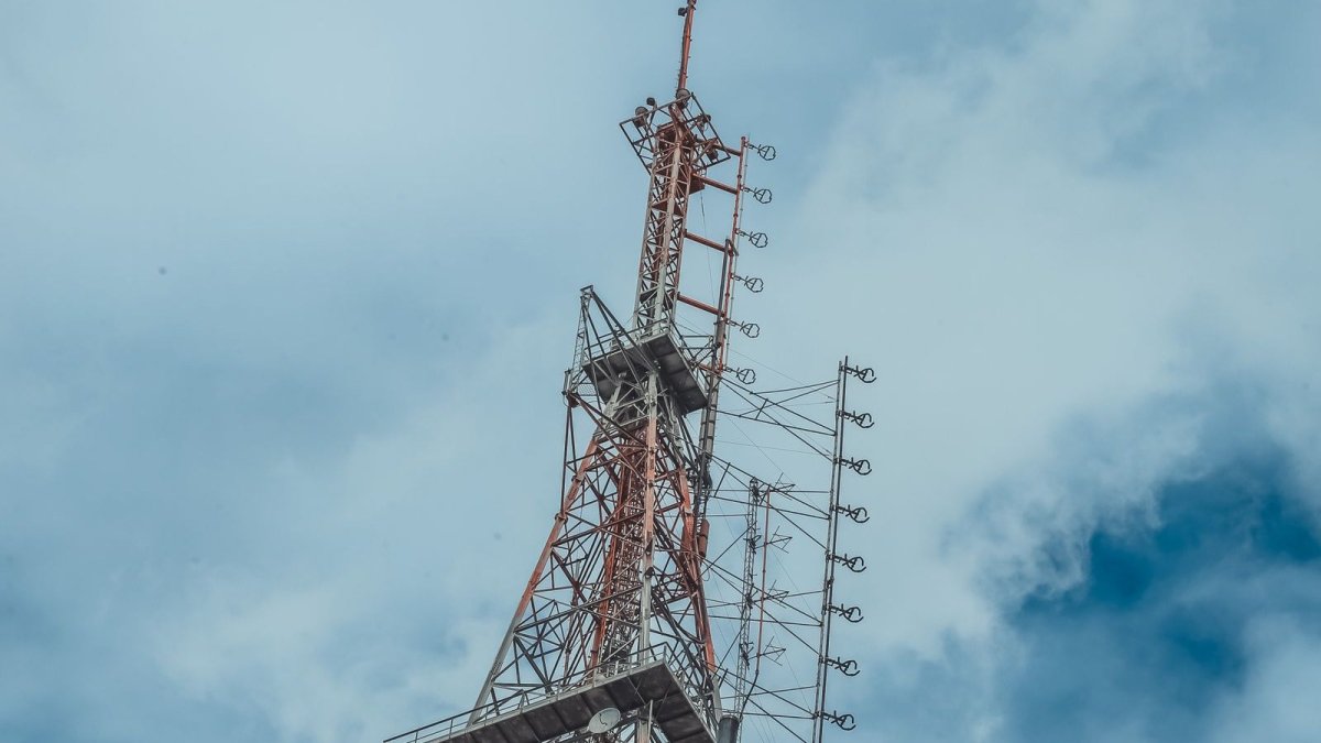 Steel antenna tower against a clear blue sky