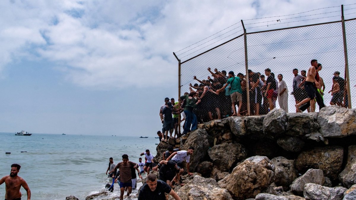 Migrants camp on a beach in Ceuta amid the ongoing crisis