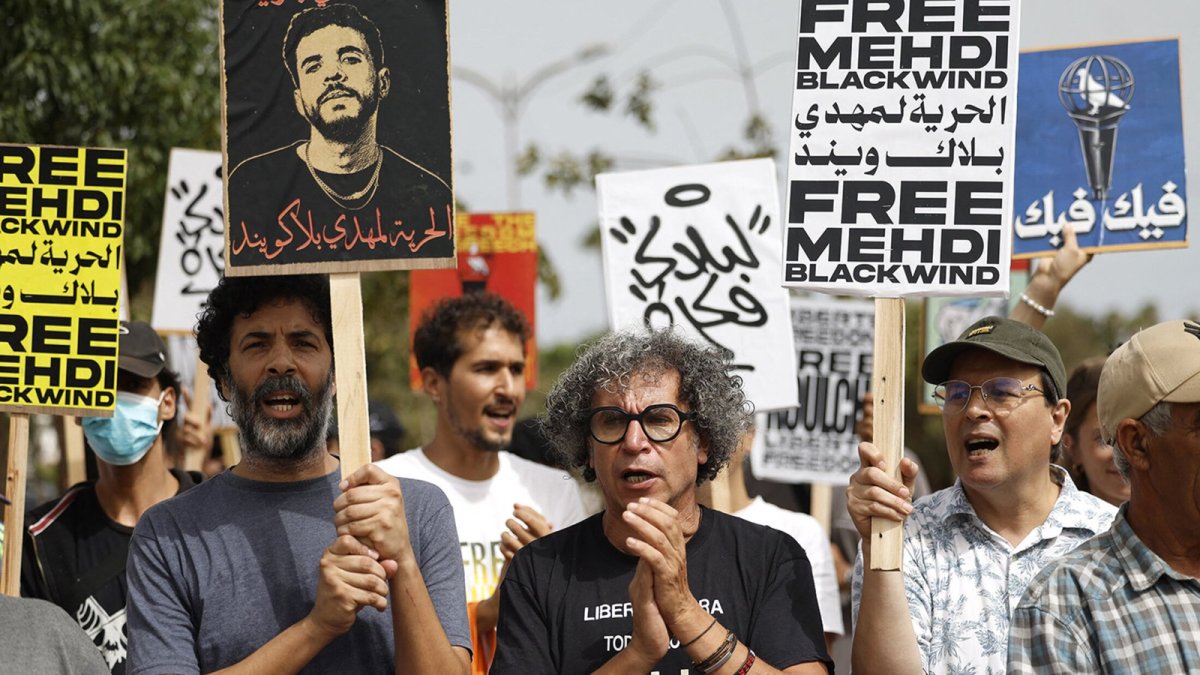 Supporters rally with Free Mehdi Blackwind signs