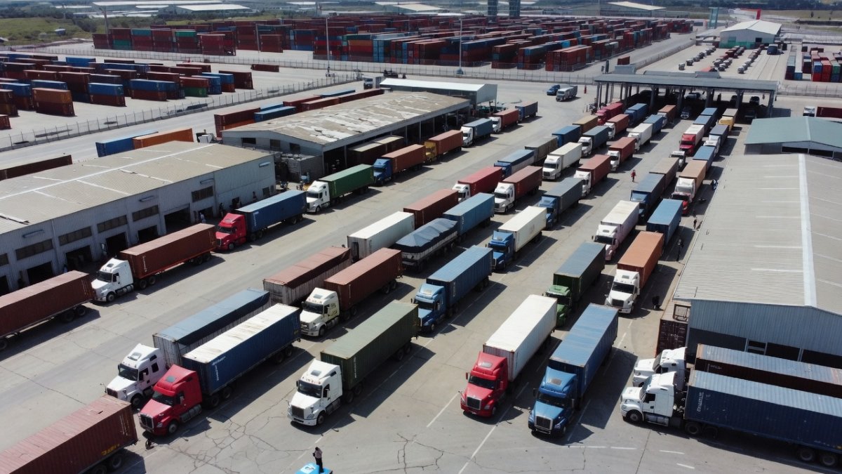 Cargo trucks at a customs inspection area near a border crossing