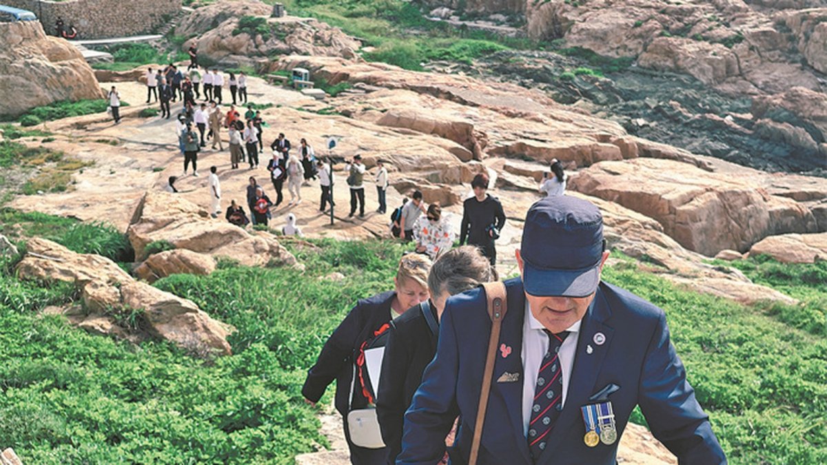 POW relatives at the Lisbon Maru survivors memorial wall in Zhoushan