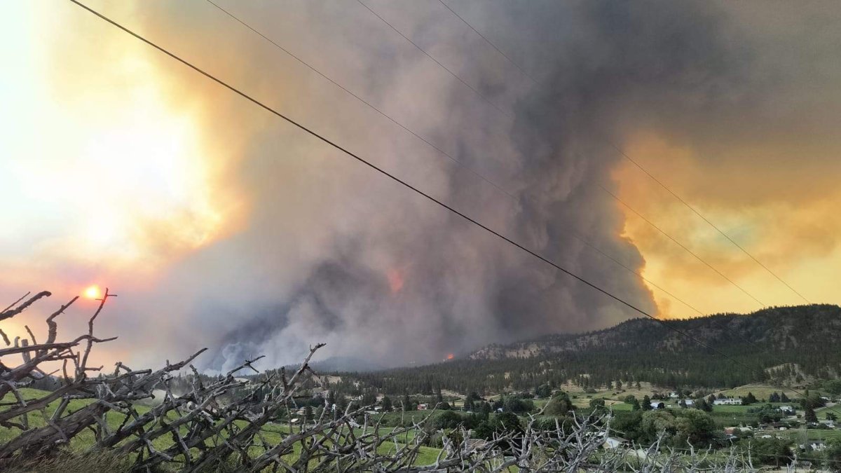 Emergency responders and aircraft assisting with evacuations near Summerland