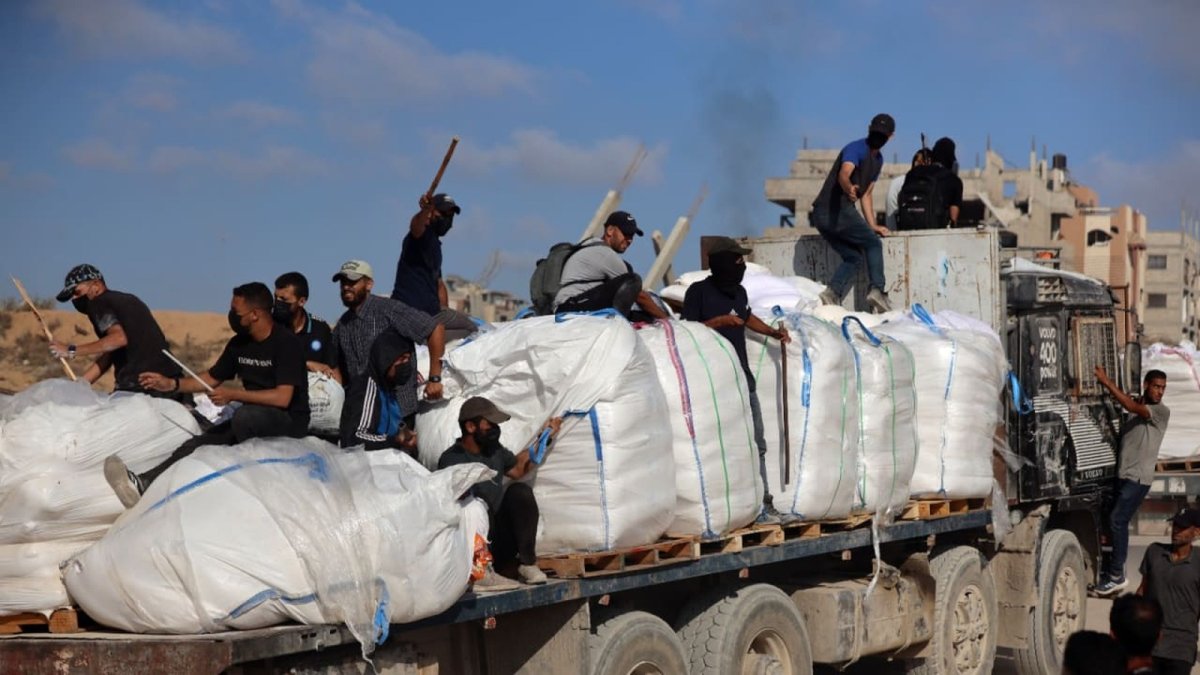 Hamas operatives securing humanitarian aid trucks in the northern Gaza area