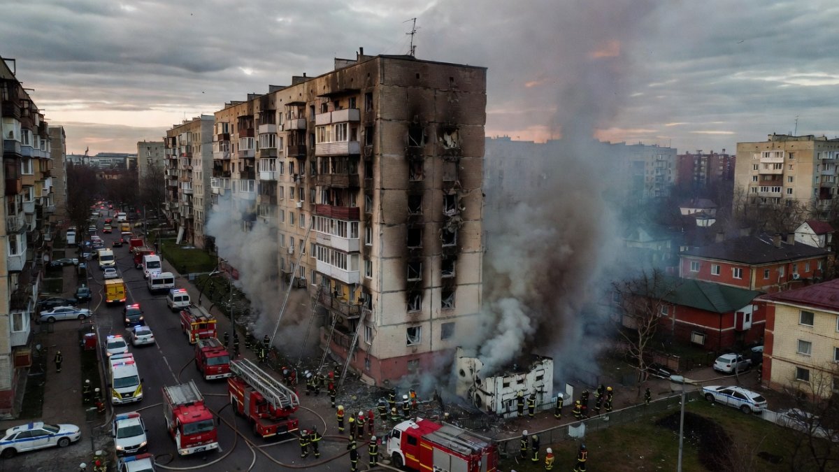 Emergency workers at the site of a Russian missile strike in Kyiv, August 2026
