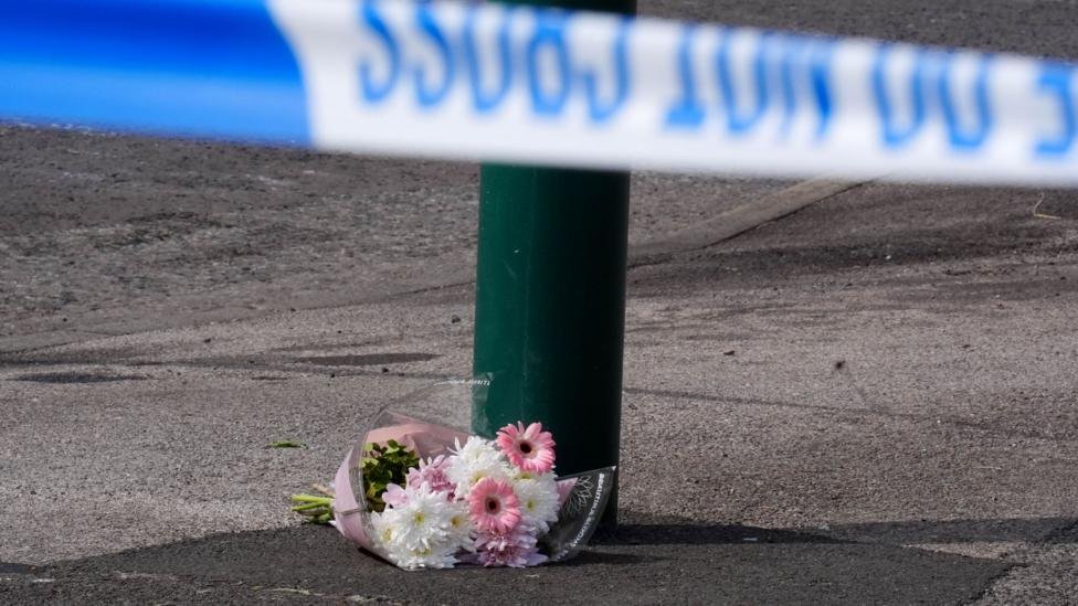 Floral tributes left near the scene of the house fire in Grangetown