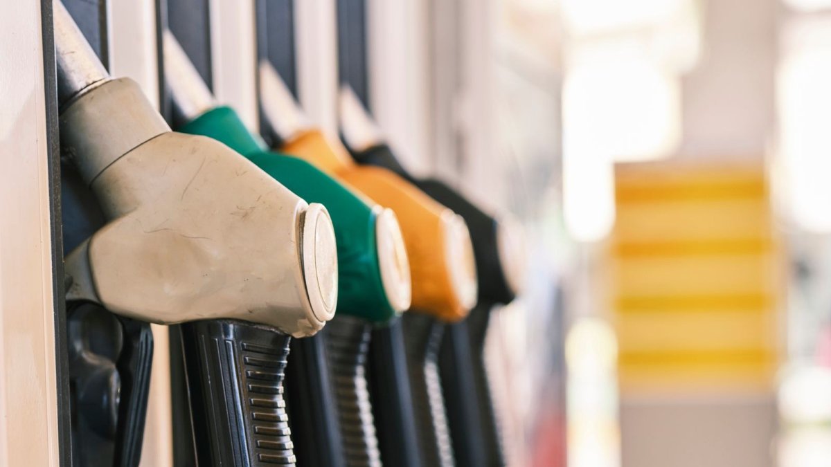 Fuel nozzles at an Indian petrol pump dispensing ethanol-blended E20 petrol