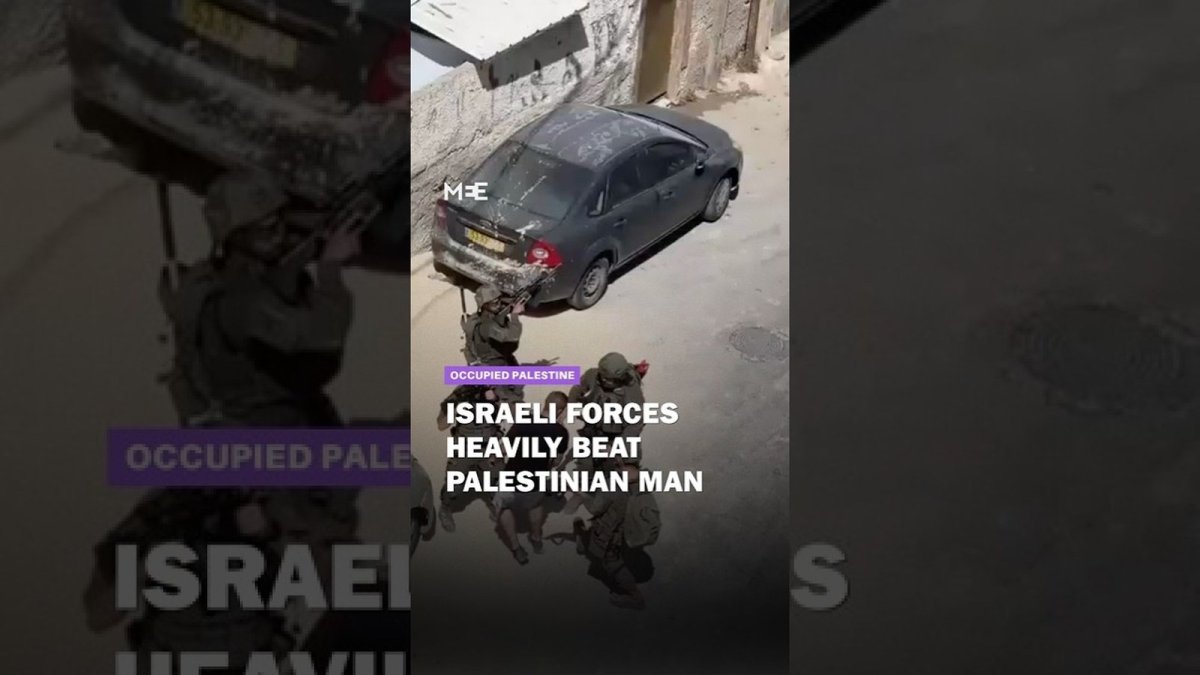 Footage still showing Israeli soldiers confronting a Palestinian man during the Qalandiya refugee camp raid