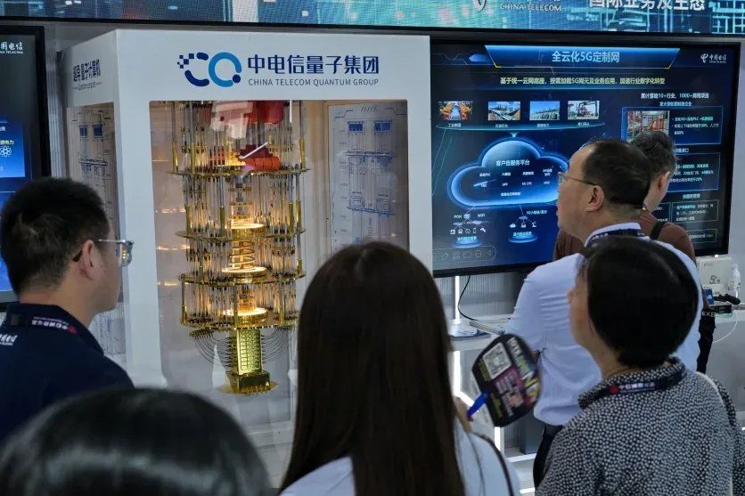 Visitors examine a quantum computing sample at the Mobile World Congress in Shanghai