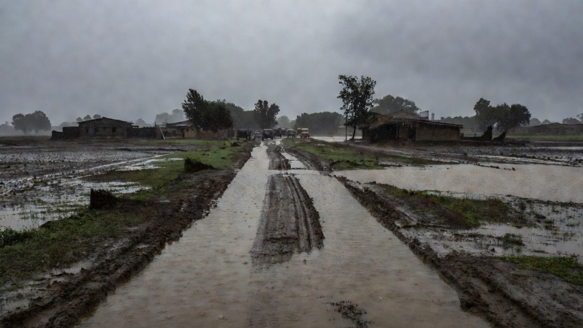 Waterlogged kutcha road in rural Telangana after monsoon rains
