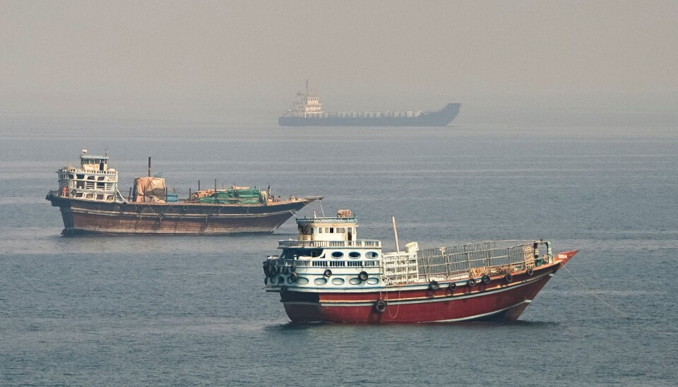 Commercial vessels near the Strait of Hormuz as seen from Musandam, Oman, August 31, 2026