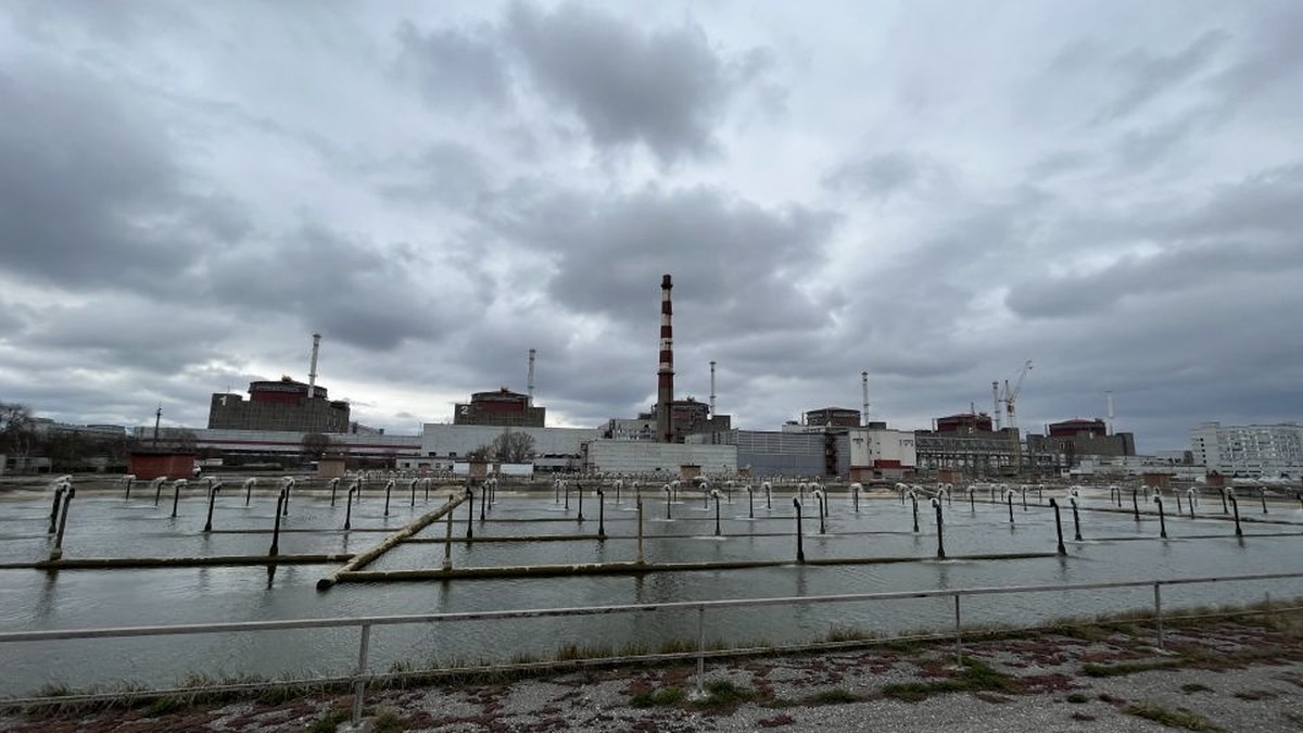 The Zaporizhzhia nuclear power plant seen across its water channel in March 2023, as its reactors sat in cold shutdown. (Fredrik Dahl/IAEA)